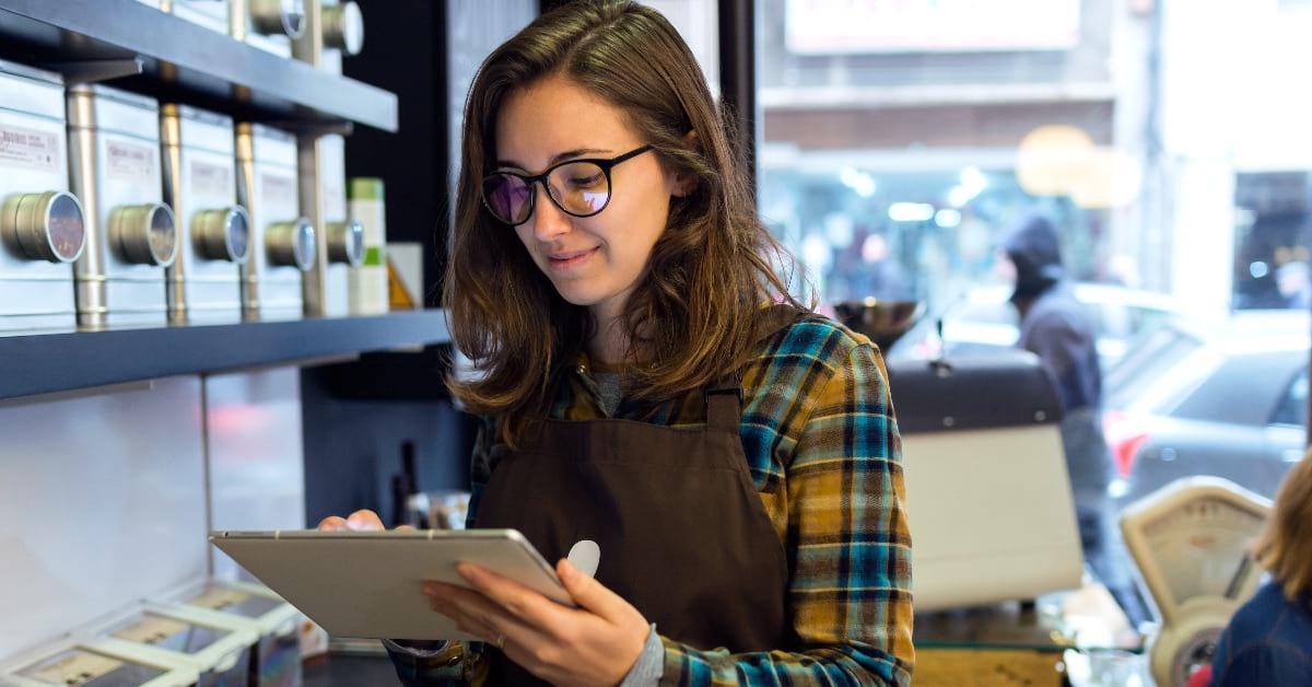 Retail worker on tablet