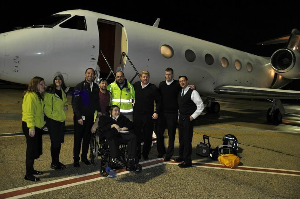 Students with disability preparing to board plane