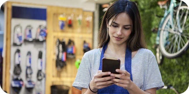 woman sending emergency alert from phone